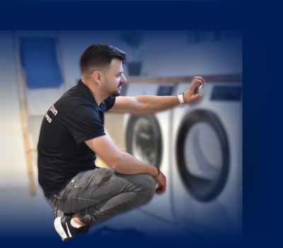 מתקין בודק את מייבש הכביסה - לחיצה על תמונה זו תעביר אותך למידע על שירותי אחזקה